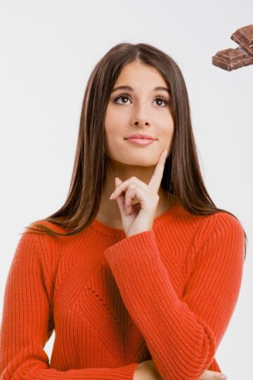 Woman thinking of chocolate.