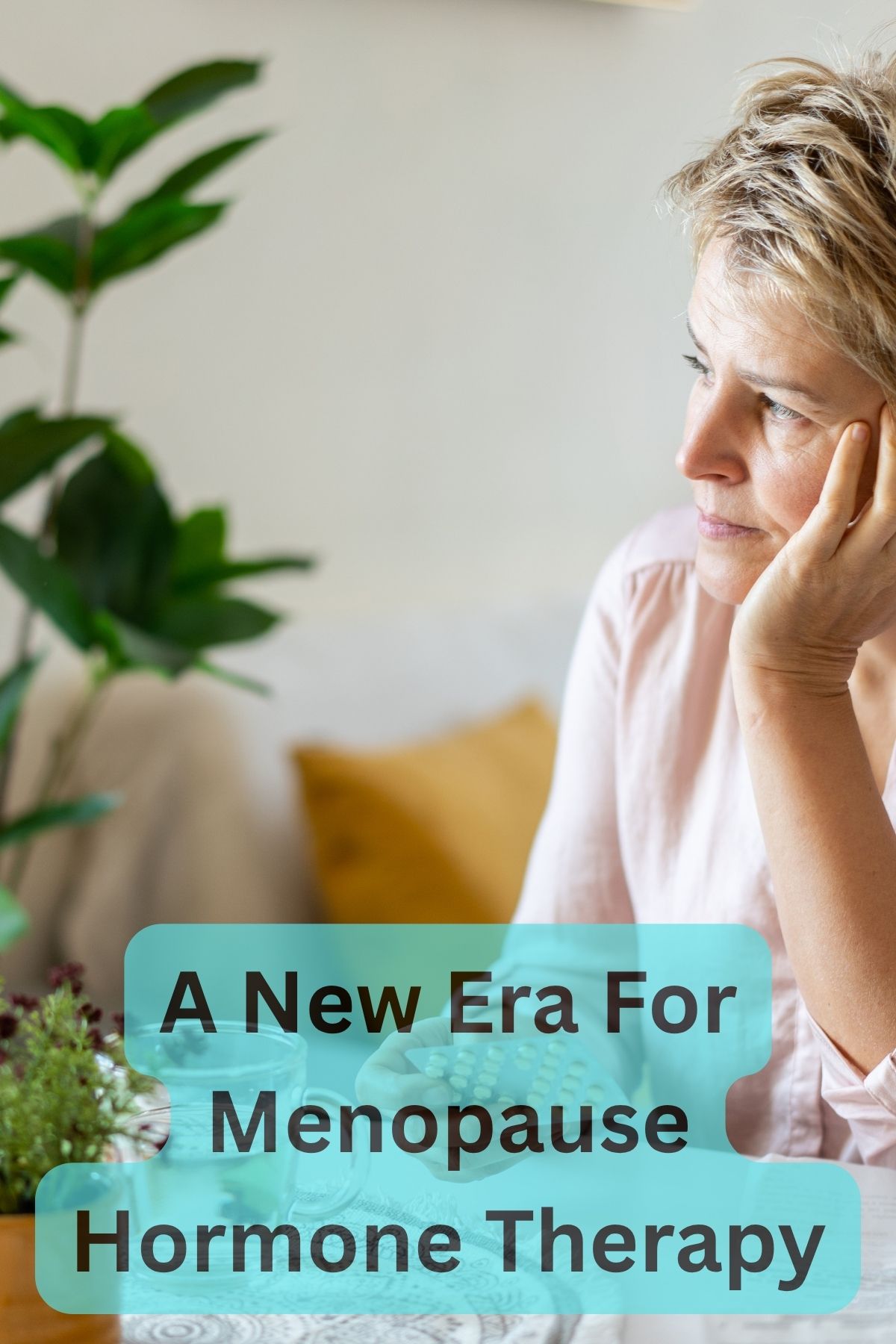 Woman sitting at a table, thinking.