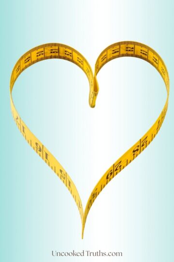 Measurement tape in a shape of a heart symbolizing metabolic reset and weight loss.