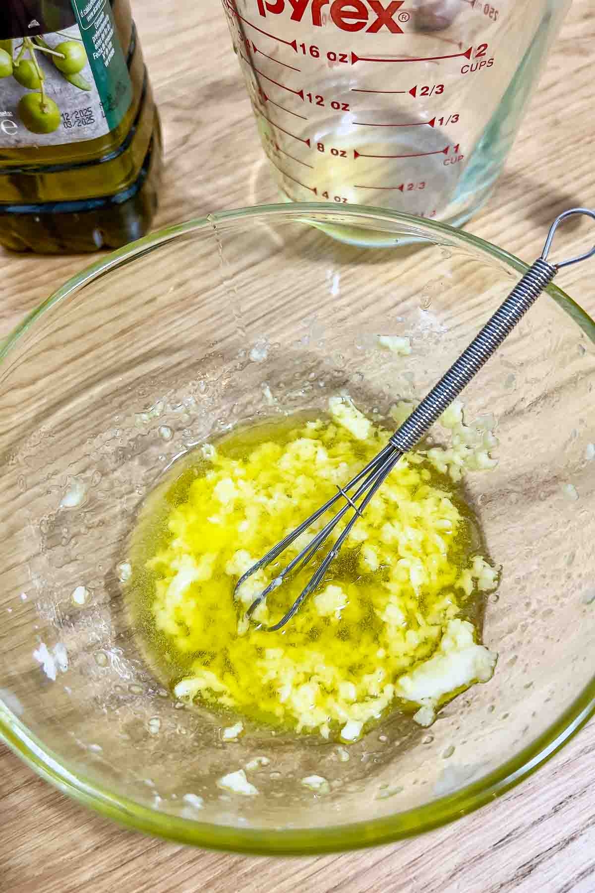 garlic with salt and olive oil in a bowl.